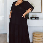 Model wearing stylish plus size black dress - Harlow Dress in Black by Peach The Label