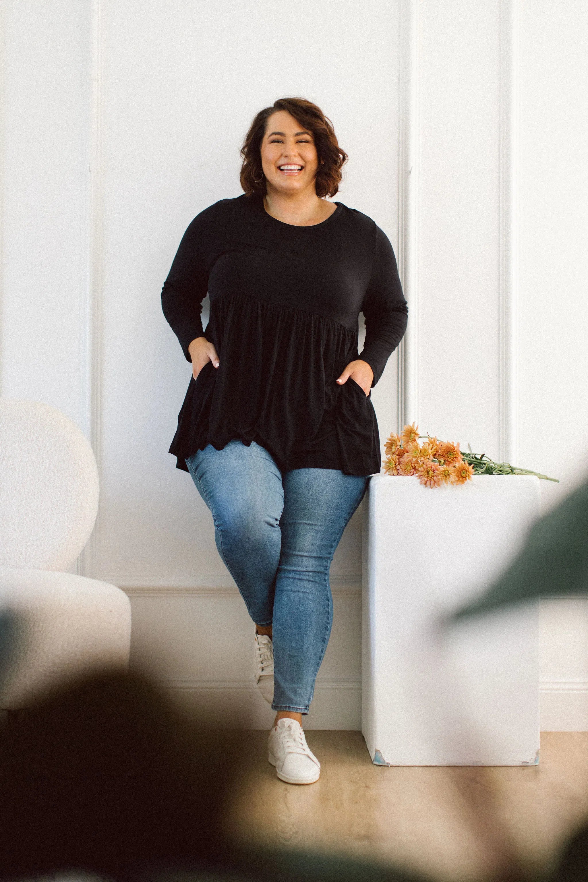 Plus Size clothing,  women modeling a black Plus Size Tops, Lucy Long Sleeve Top in black