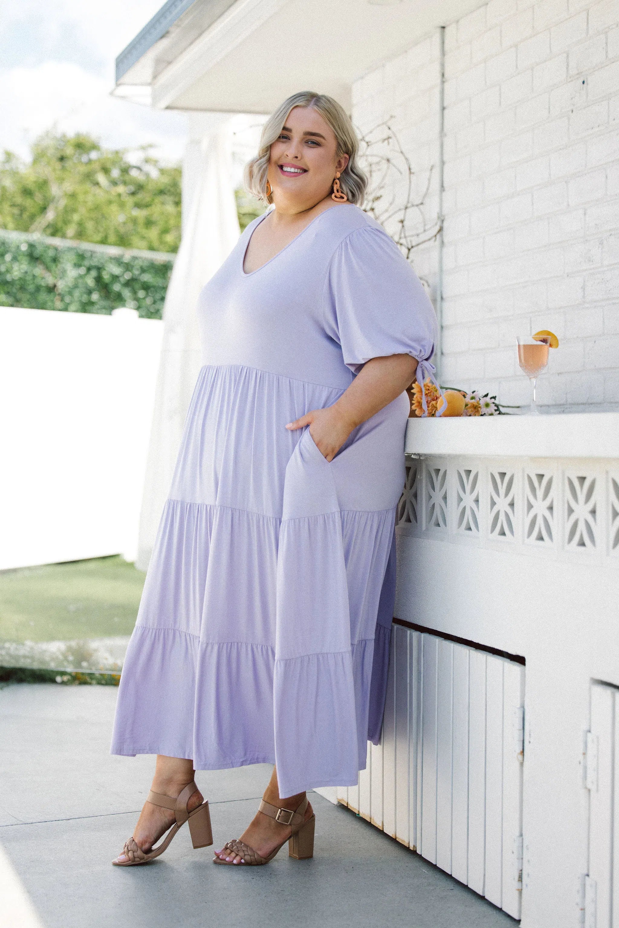 Model in stunning plus size dress - Harlow Dress in Purple Lilac by Peach The Label