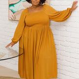 Model showcasing designer plus size dress - Lexi Dress in Honey by Peach The Label