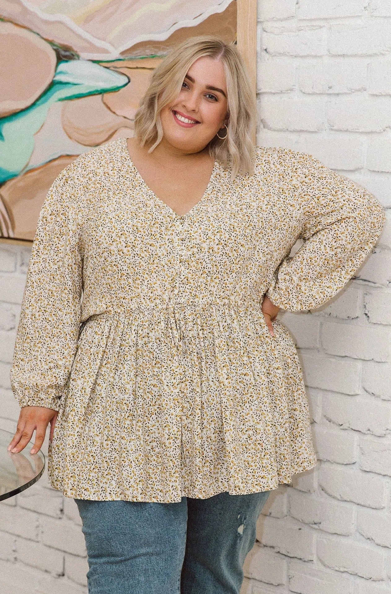 Plus Size fashion,  women modeling a Plus Size V-Neck Top - Embrace Chic Style with Isla Top in White Ditsy