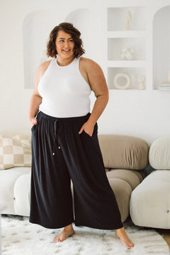 Model Flaunting Women's Plus Size Black Pants - Darcy Pants in Black