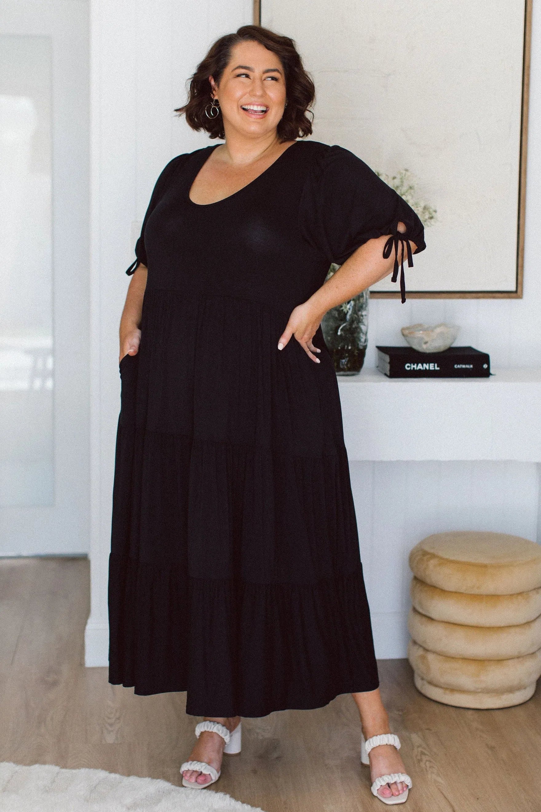 Model wearing stylish plus size black dress - Harlow Dress in Black by Peach The Label