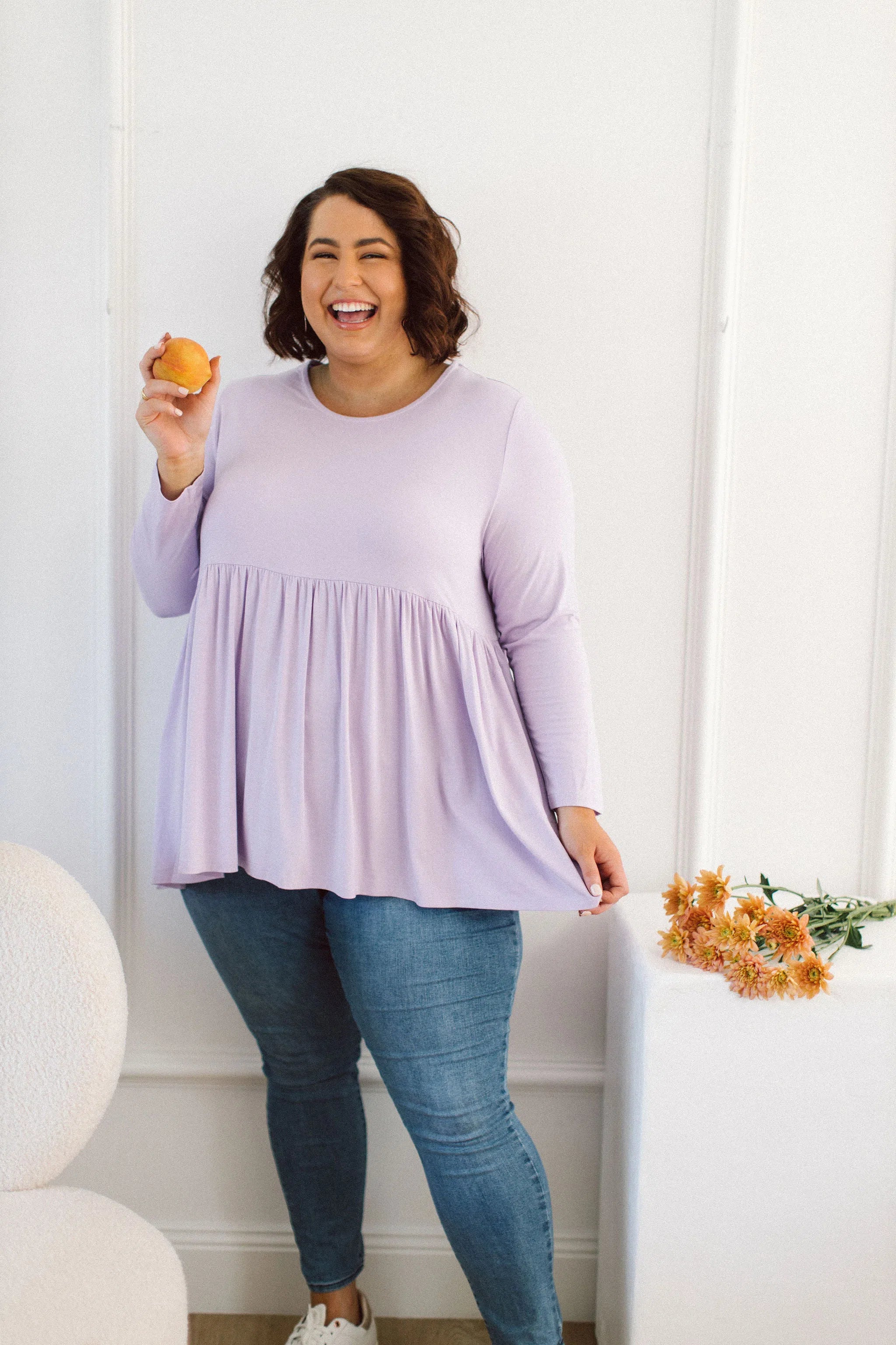Plus Size clothing,  women modeling a Womens Plus Size Tops, Lucy Long Sleeve Top in Purple Lilac