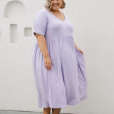 Model presenting women's plus size dress online - Ashleigh Dress in Lilac by Peach The Label