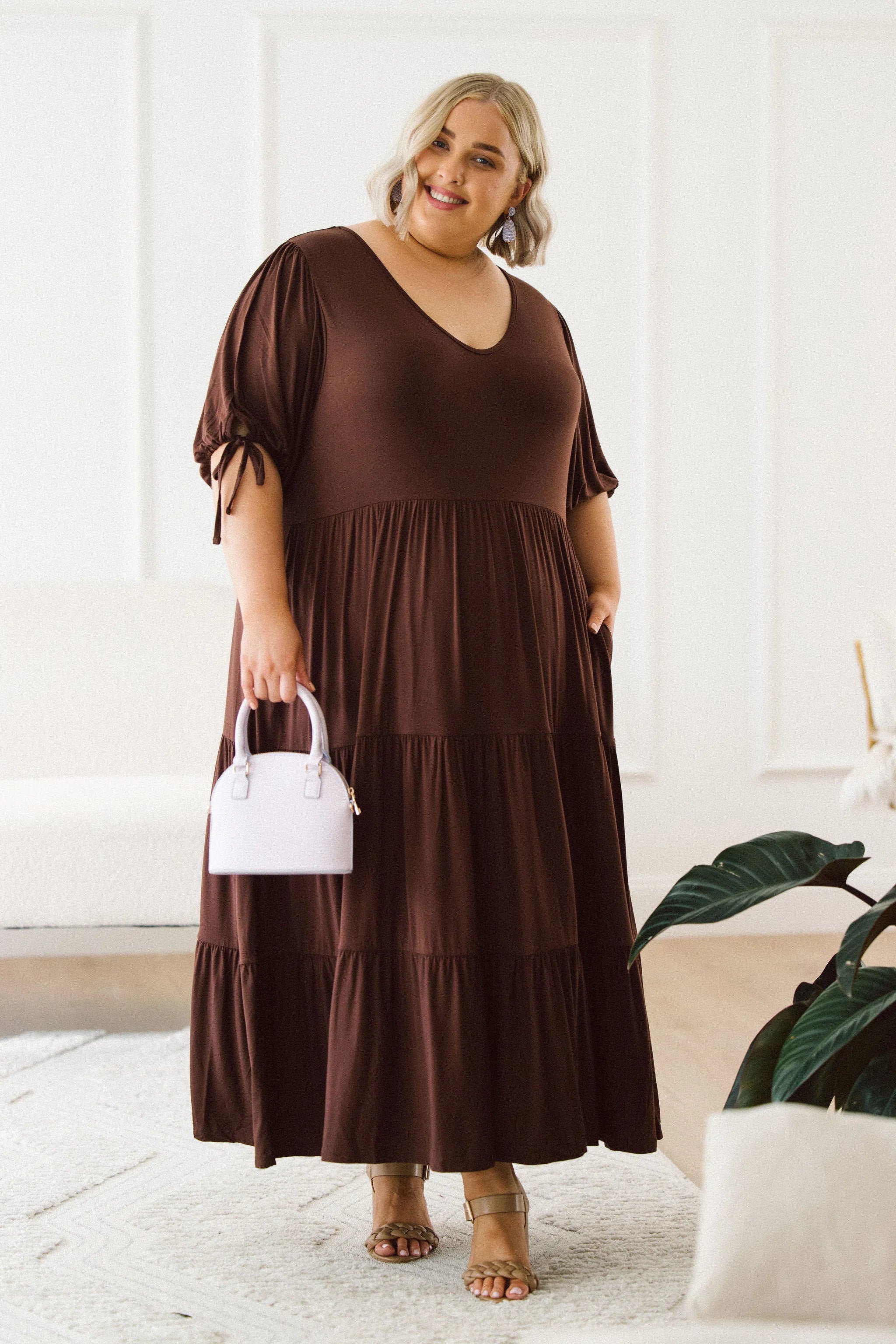 Model in elegant plus size brown dress - Harlow Dress in Chocolate by Peach The Label