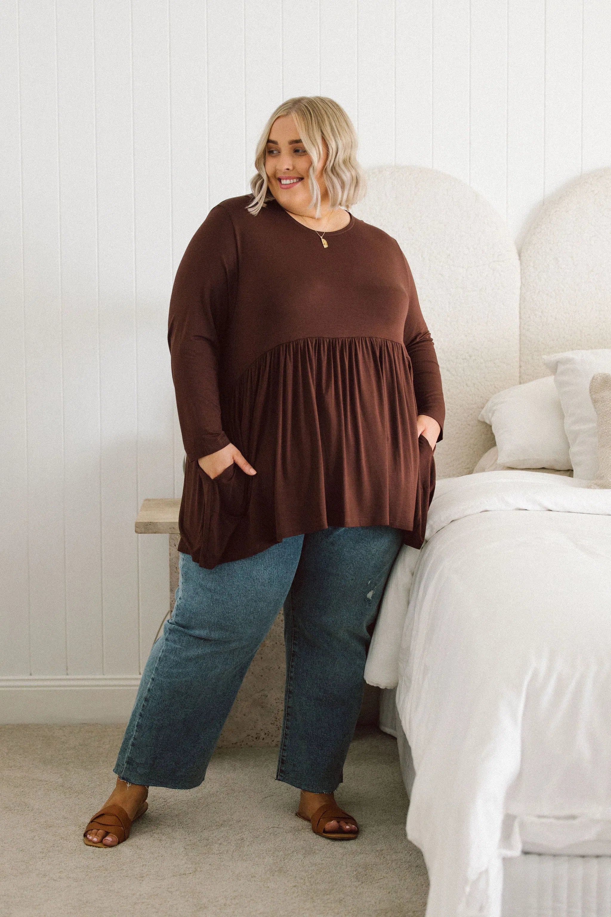 Plus Size clothing,  women modeling a winter Curvy Womens Tops, Lucy Long Sleeve Top in Purple chocolate brown
