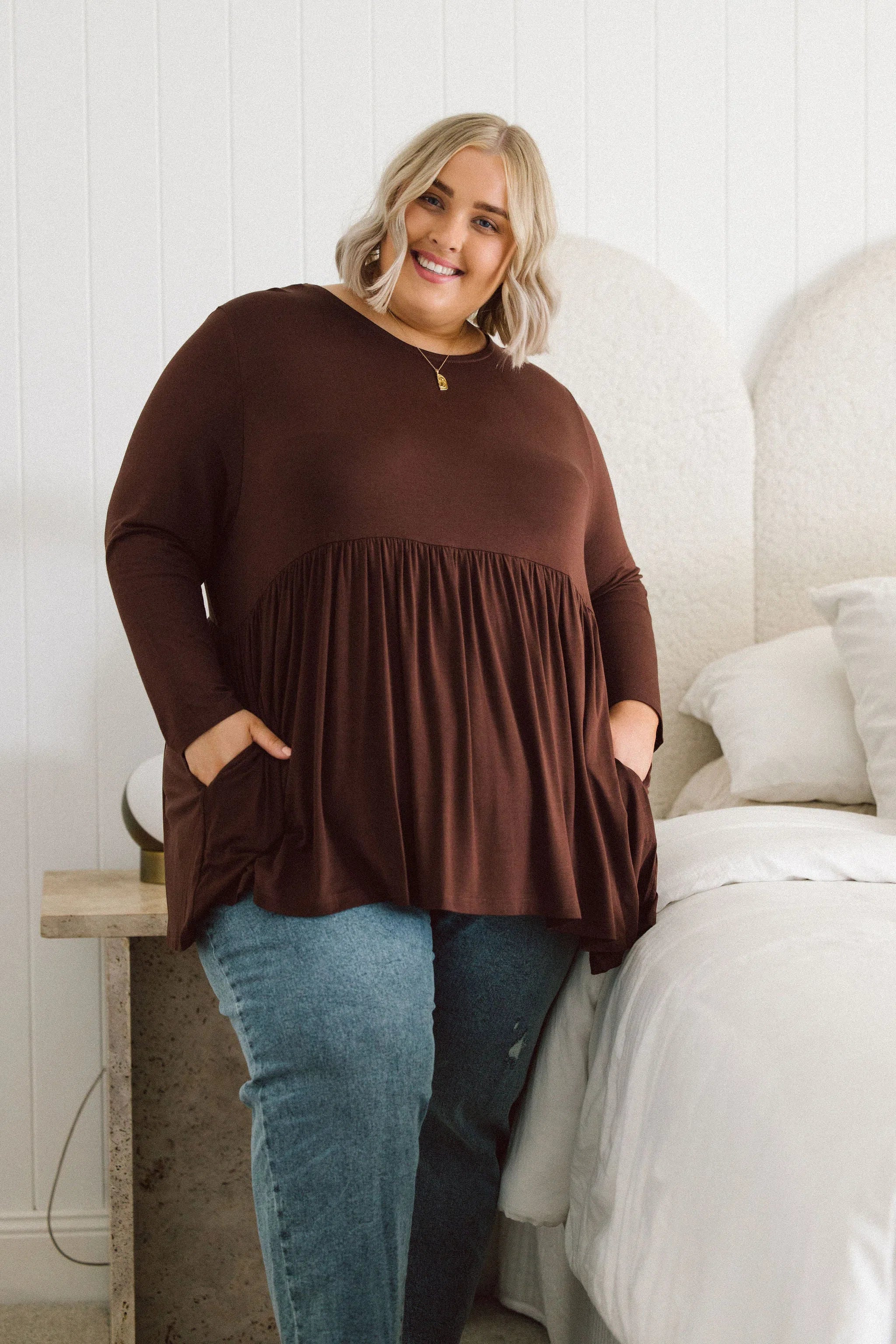 Plus Size clothing,  women modeling a winter Plus Size Tops, Lucy Long Sleeve Top in Purple chocolate brown