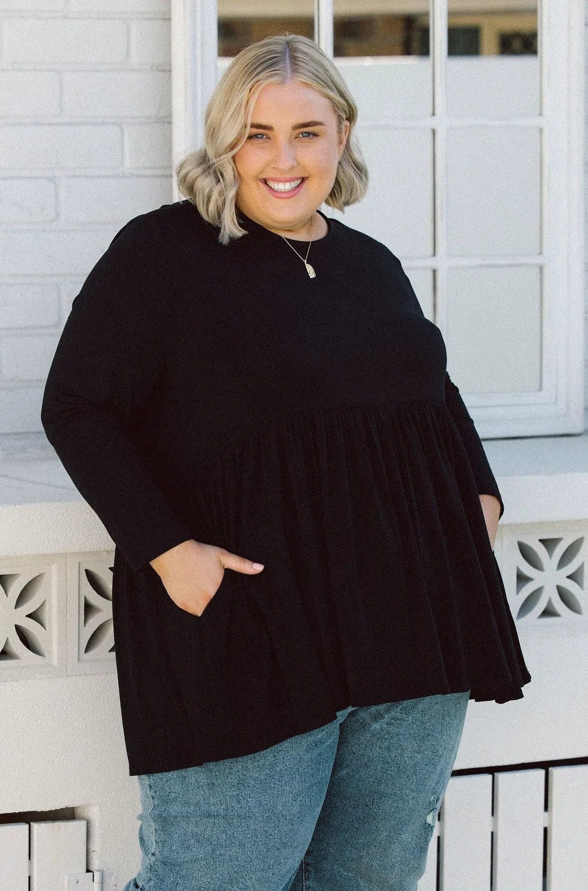 Plus Size clothing,  women modeling a Black Plus Size Long Sleeve Top - Elevate Your Style with Lucy Long Sleeve Top