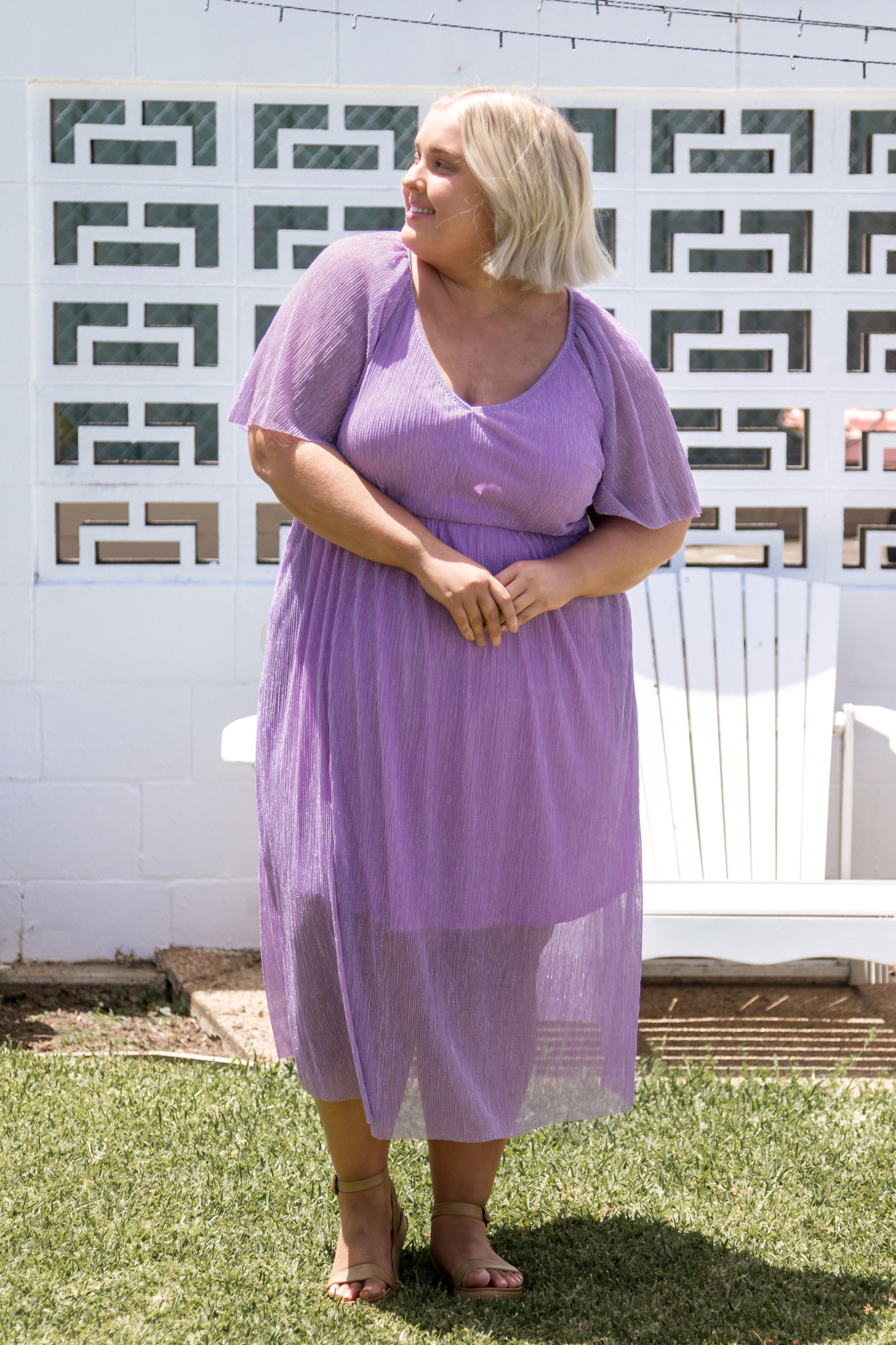 Model Showcasing Shimmering Plus Size Dress - Nova Dress in Amethyst Sparkle