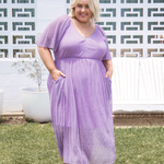 Model showcasing curvy plus size evening dress - Nova Dress in Amethyst Sparkle by Peach The Label